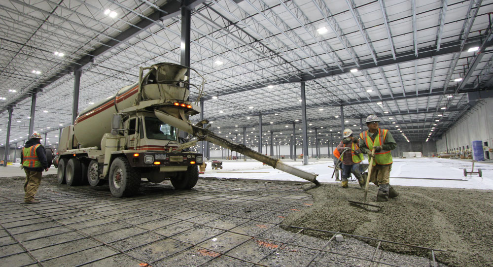 Pavement being laid out inside a new facility